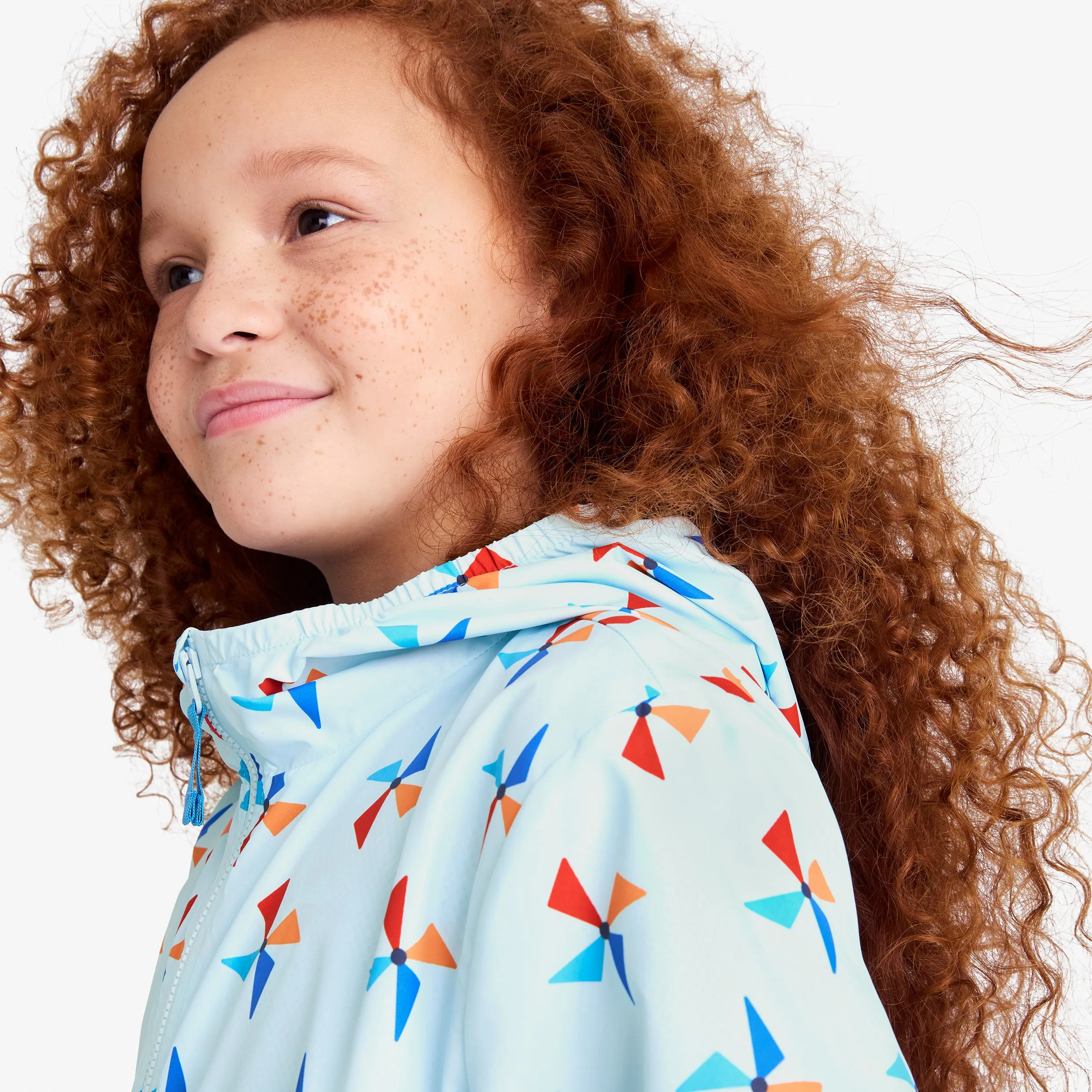 Kids packable windbreaker in pinwheels